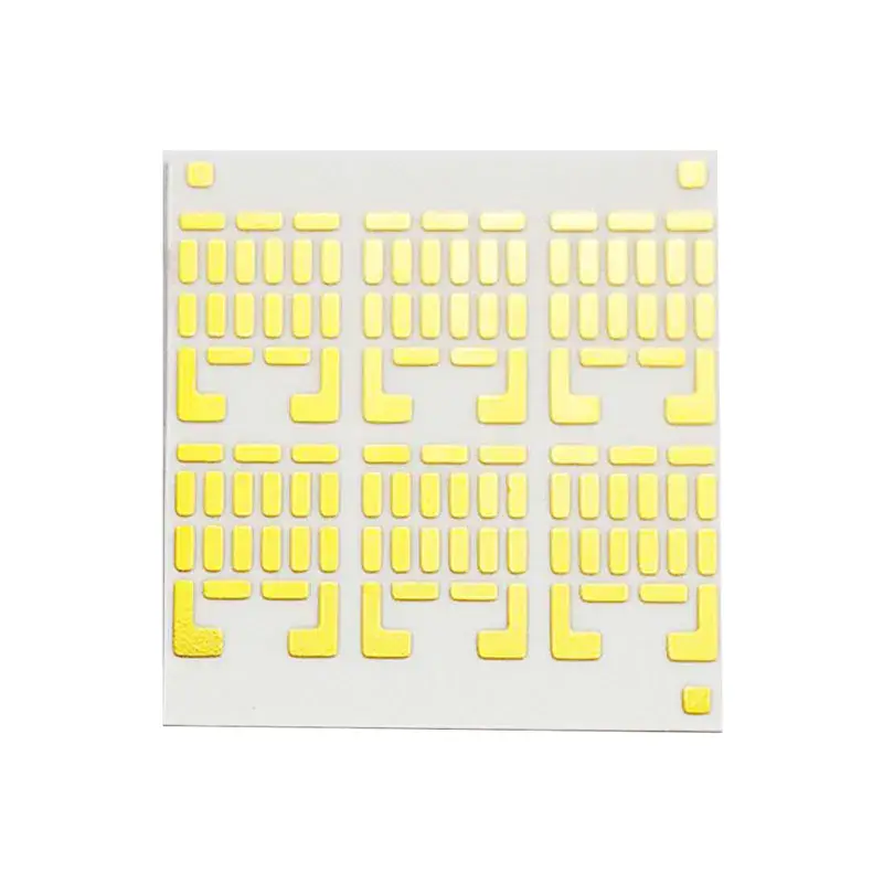 Sheet of yellow adhesive masking pads with rectangular and L-shaped patterns, used for PCB assembly and surface mount technology.
